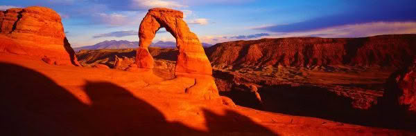 Vast landscape of Delicate Arch at sunset, Arches National Park, USA.