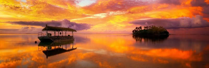 Muri Beach Dawn, Rarotonga. Dramatic dawn light reflects in the water at Muri Beach