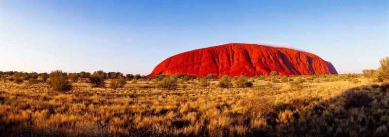 Urulu. Sunrise makes a bright scene at Urluru, Northern Territory, Australia.