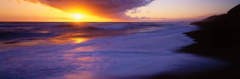 Wild Mahia Dusk A vast seascape with setting sun and coastline at Mahia Peninsula, New Zealand.