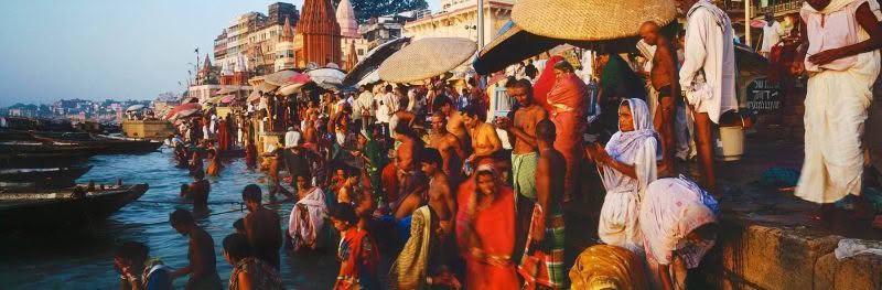 Worship People bathing and worshiping in the river Ganges, Varanasi, India.