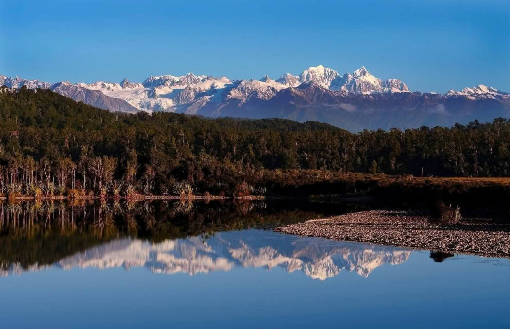 New Zealand Landscape Photography Three Mile Lagoon southern alps reflecting in lagoon on stunning winters day