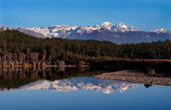 New Zealand Landscape Photography Three Mile Lagoon southern alps reflecting in lagoon on stunning winters day