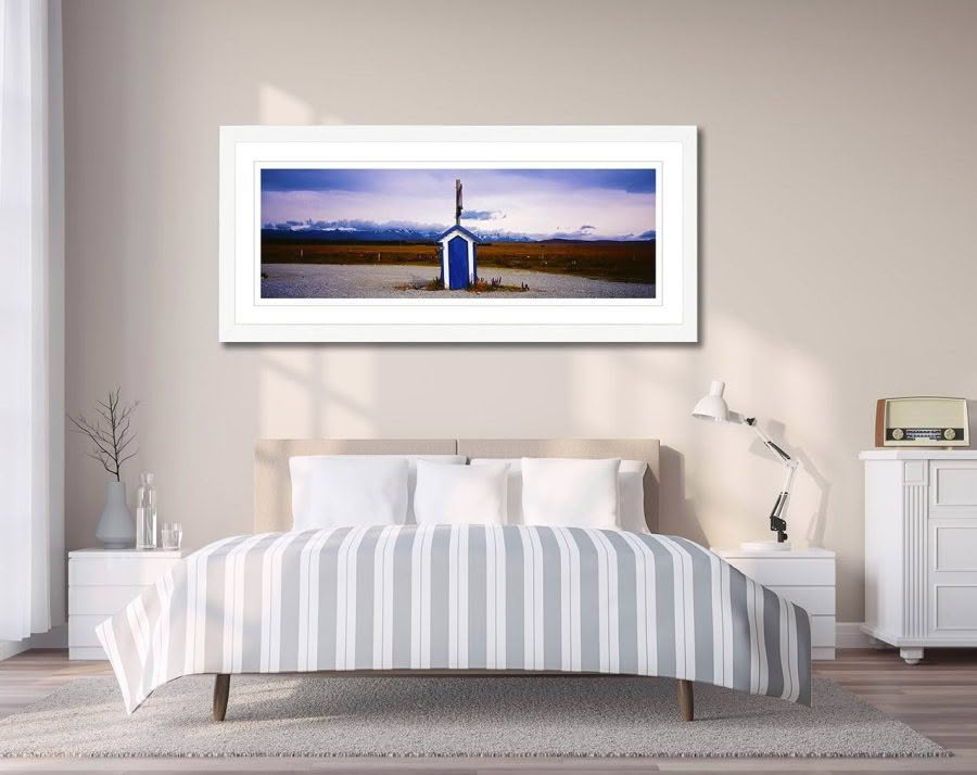 Framed photo artwork of Irishman Creek hut by Richard Hume on wall in bedroom, Tekapo, New Zealand