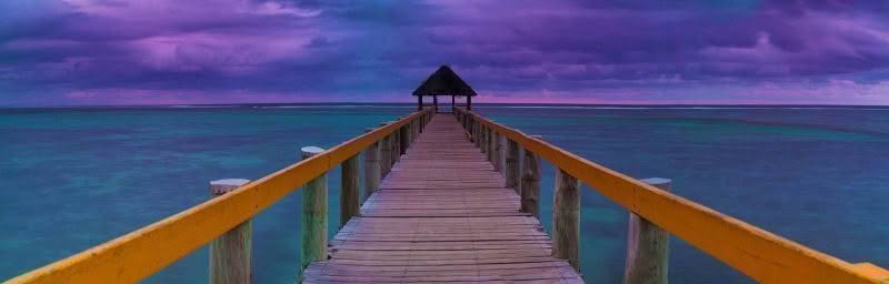 Maui Bay Jetty, Fiji. Panoramic shot of jetty at Maui Bay with dramatic storm clouds in horizon at dusk