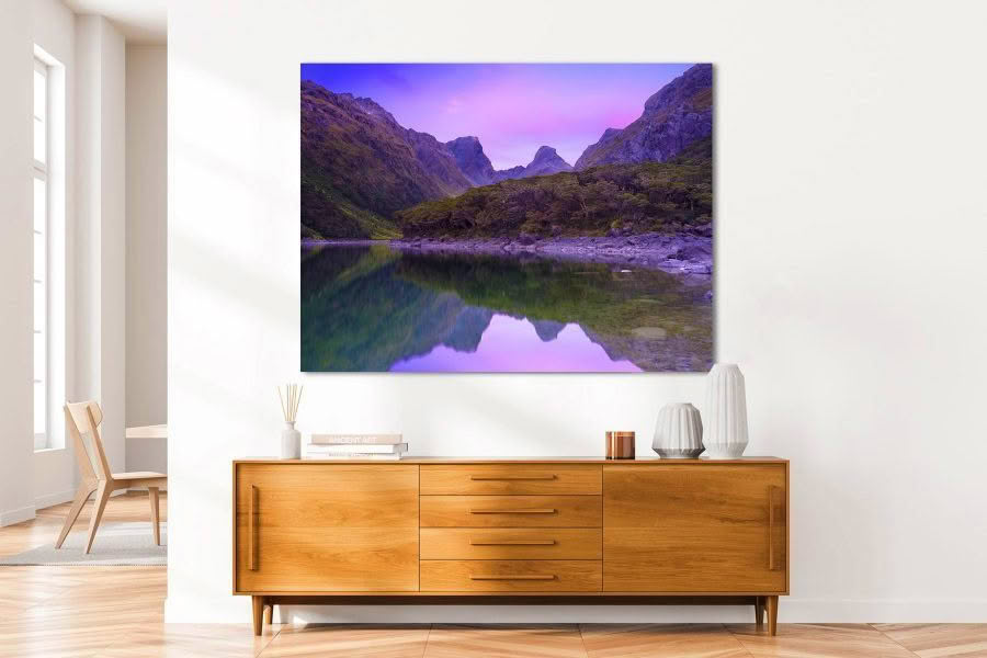 New Zealand Landscape Photography Lake Mackenzie on the Routeburn Track. Dawn pink light of mountains reflected in lake.