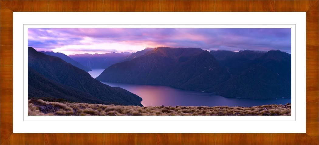 New Zealand Landscape Photography. Lake Te Anau at dusk with pink sky and Murchison Mountains