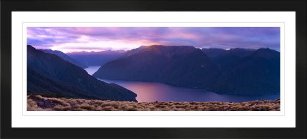 New Zealand Landscape Photography. Lake Te Anau at dusk with pink sky and Murchison Mountains