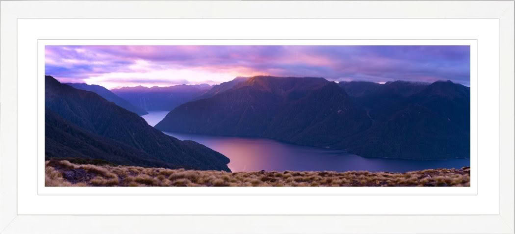 New Zealand Landscape Photography. Lake Te Anau at dusk with pink sky and Murchison Mountains