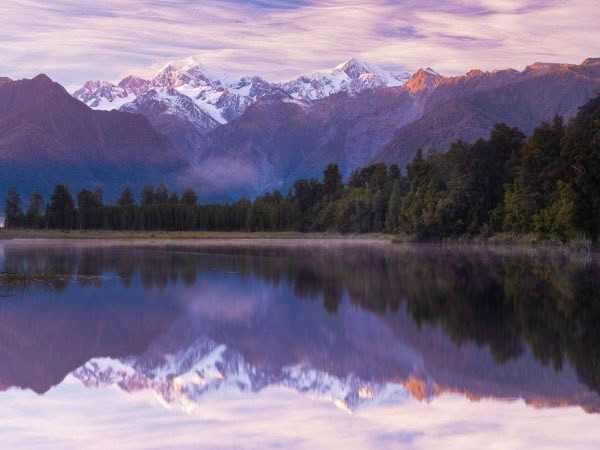 Lake Matheson on the West Coast of the South Island. Mt Cook reflected in the dawn light