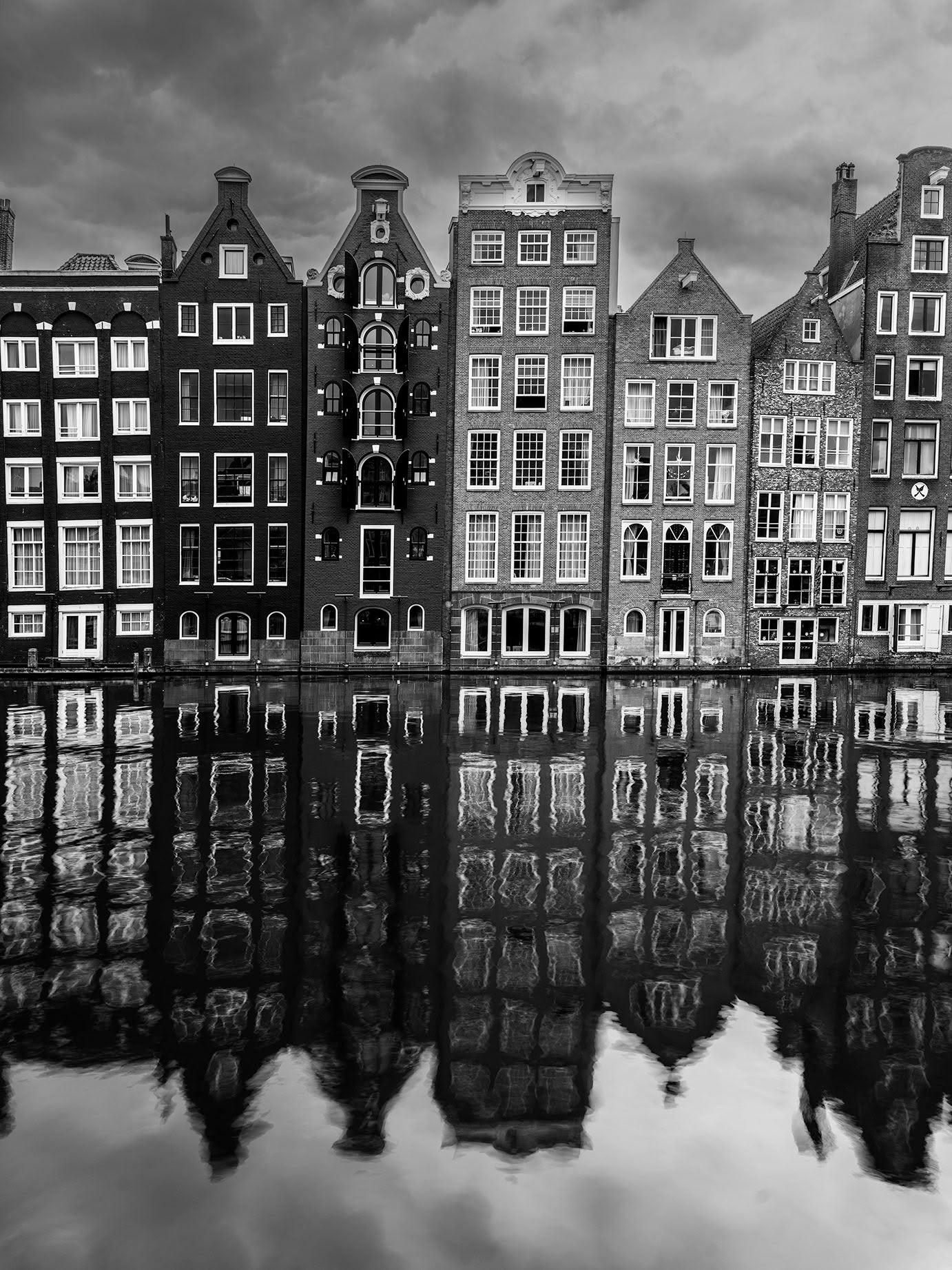 Damrak Canal Houses reflections black and white photography