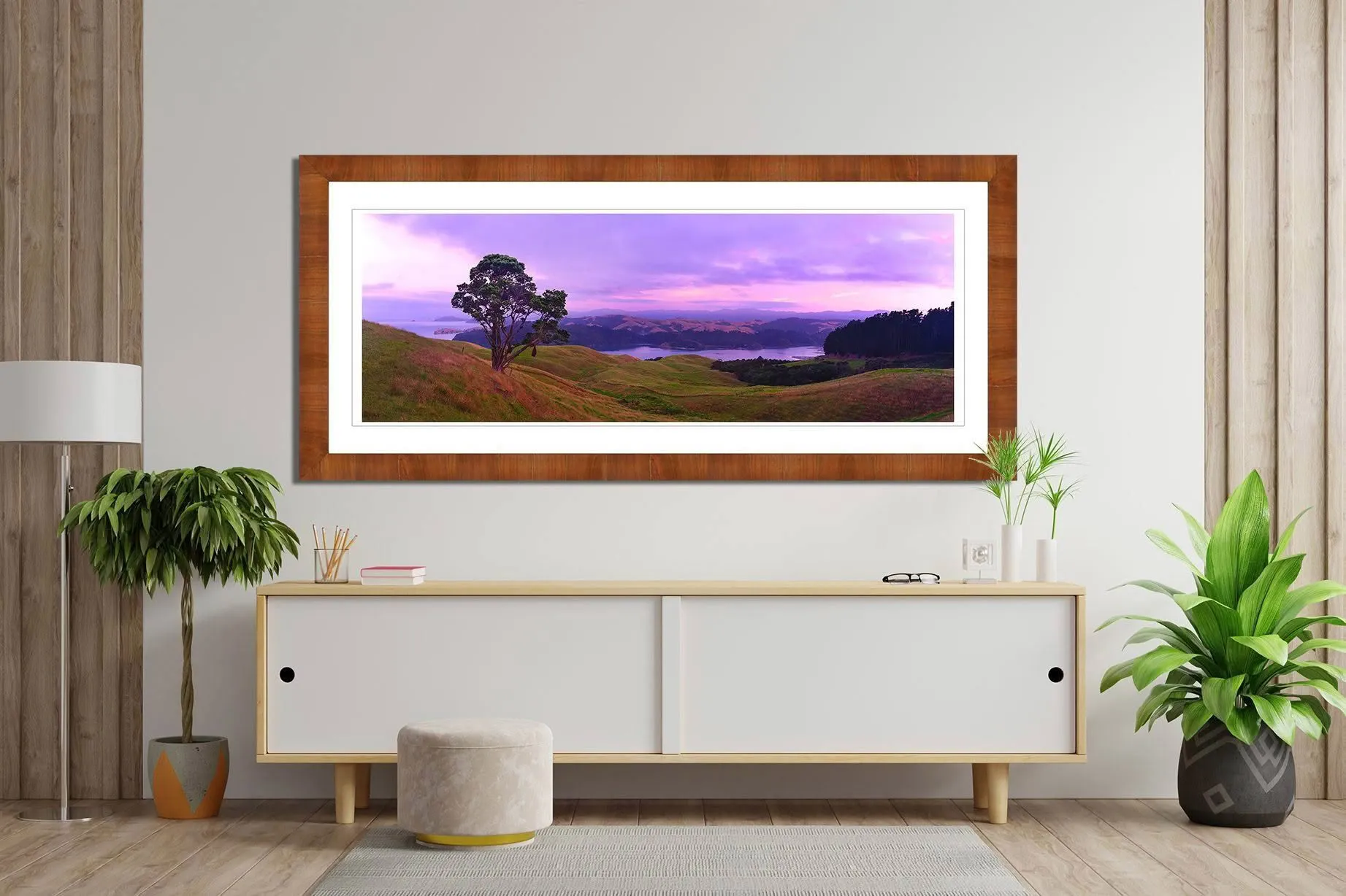 Framed landscape photograph of Coromandel Harbour displayed in a room interior representing classic New Zealand Landscape Photography