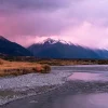 Aoraki / Mount Cook National Park seen from the Tasman Valley at dusk with river reflections and mountain light