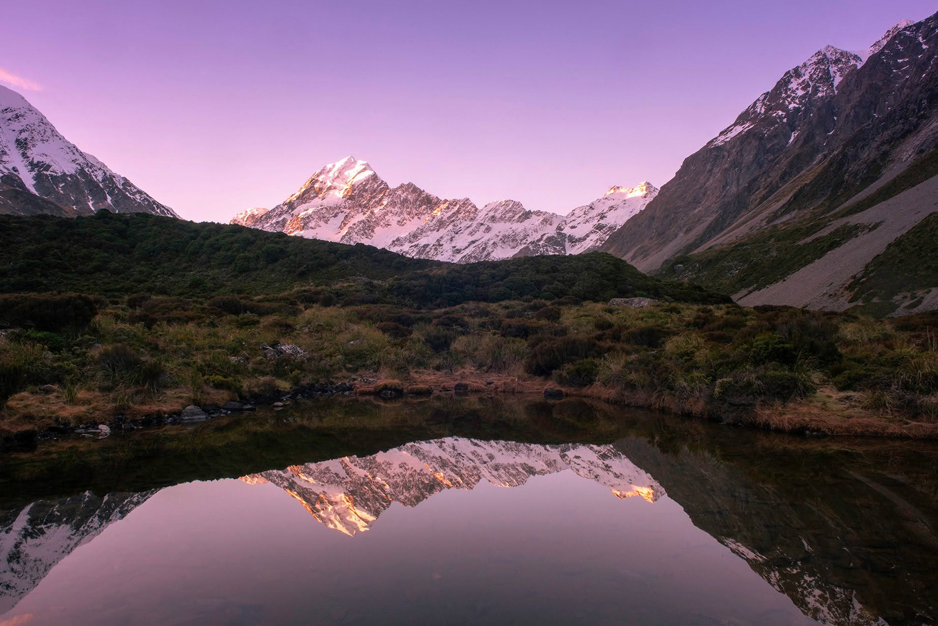 Aoraki Mount Cook reflected in an alpine tarn in the Hooker Valley