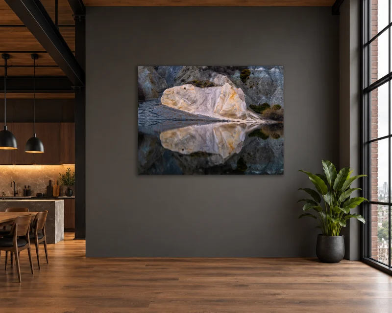 Blue Lake Reflections displayed as a large frameless photographic print on a charcoal wall in a contemporary loft interior.